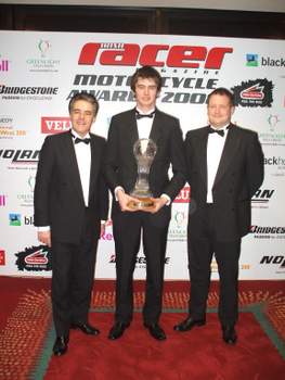 Conor Cummins (centre) with the Geoff Duke Trophy. Also pictured are Peter Duke (left) and Jon Quayle, from Duke